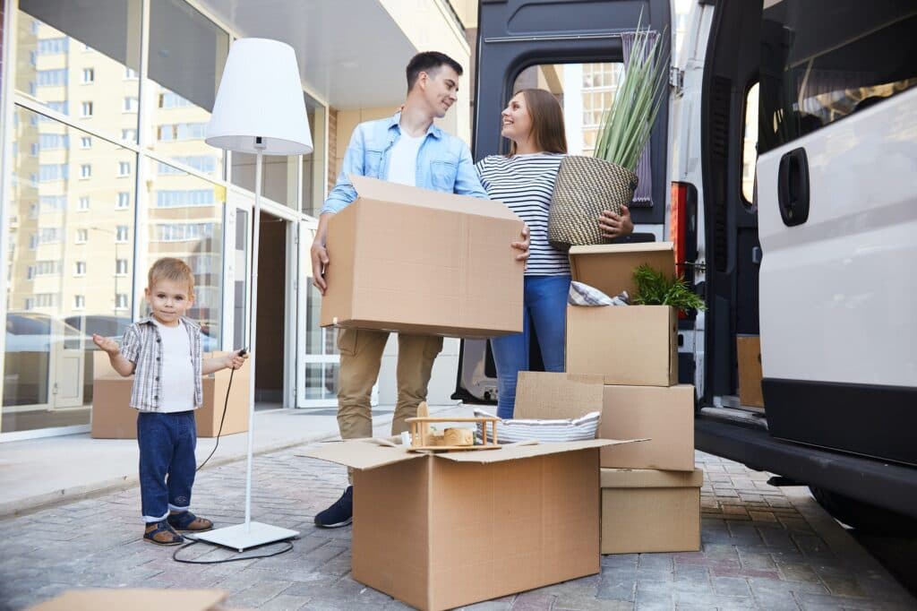 Happy family moving into a new home