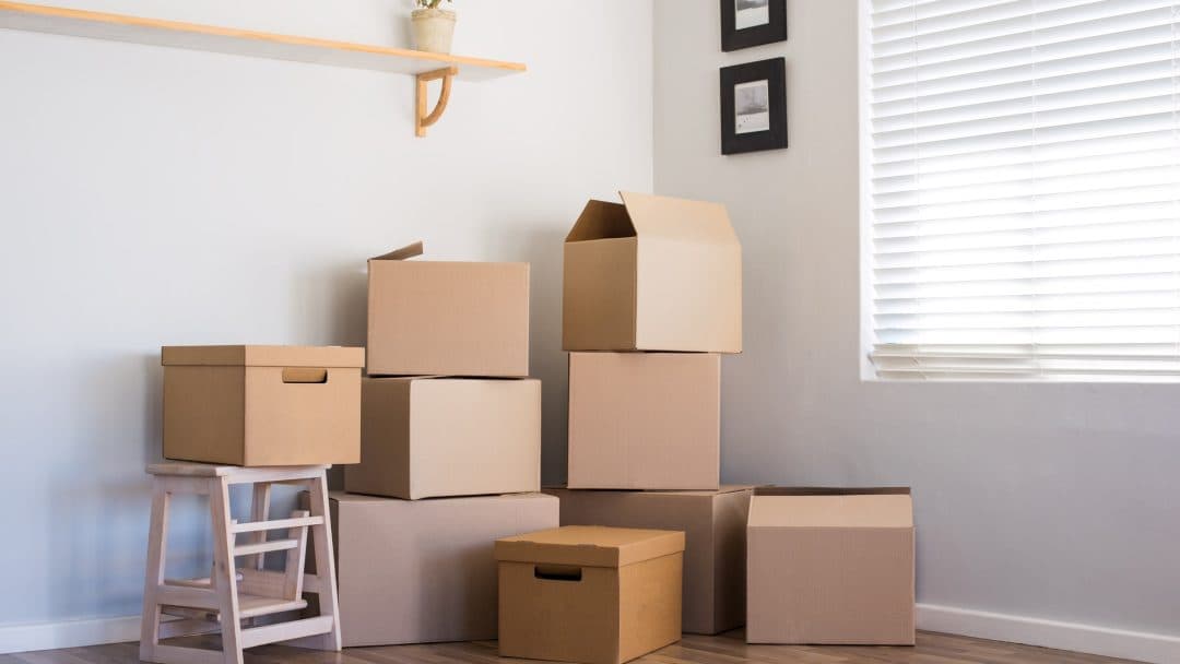 Moving boxes stacked in a house
